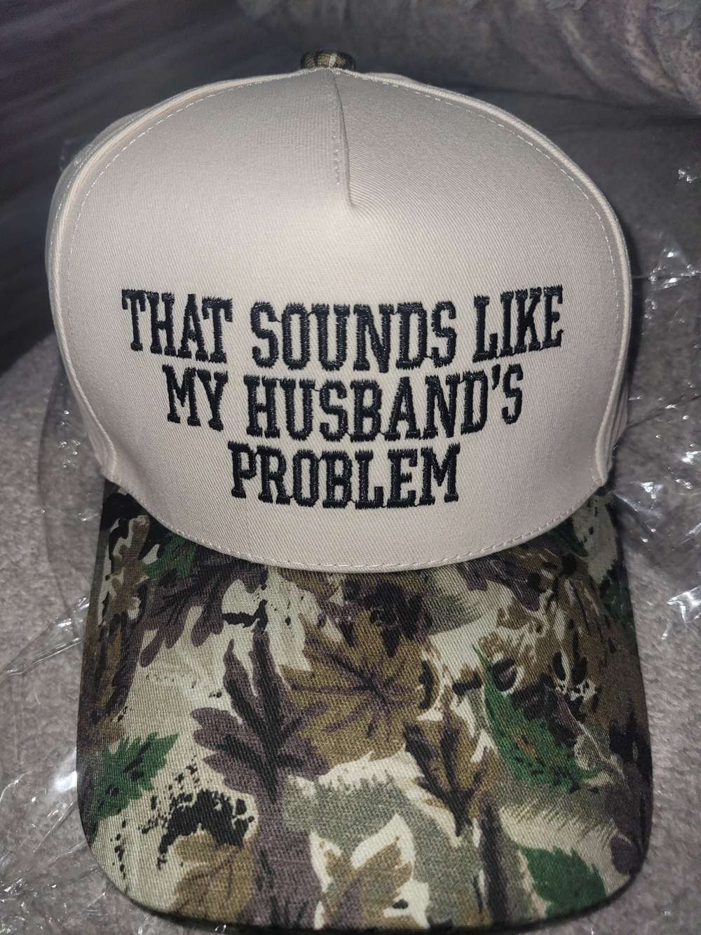 Embroidered Trucker Hat - "That Sounds Like My Husband's Problem" - Beige & Camo